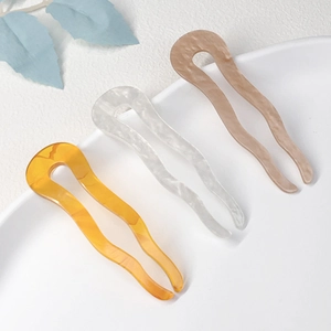 Three-piece acetate U-shaped hair pins set in amber, marble white, and beige tones