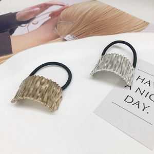 Set of gold and silver hair ties with tree-textured metal curved plates for women