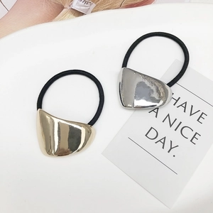 Two-piece minimalist elastic hair ties with gold and silver metallic geometric charms