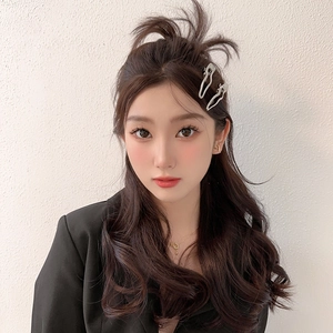 Japanese style silver wave hair clips for women with a minimalist metallic texture finish
