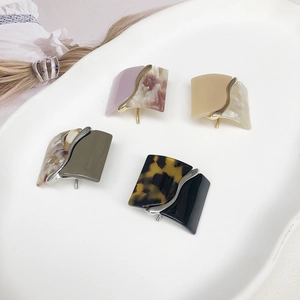 Square resin leopard print hair clips set in four colors for elegant low ponytail styling