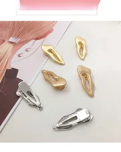 Detailed view of irregular wavy metal hair clips in gold, rose gold, and silver finishes