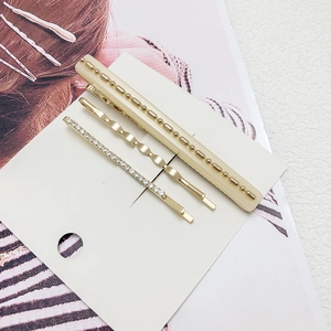 Lot de trois barrettes à cheveux avec perles crème, pince dorée et strass brillants