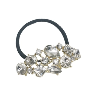 Elastico per capelli nero con strass geometrici scintillanti su base dorata
