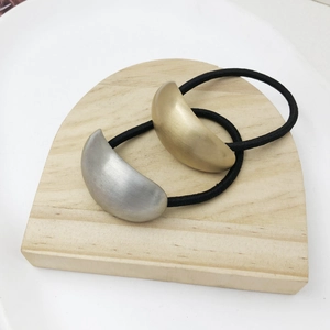 Minimalist matte metal hair tie set with gold and silver crescent charms for ponytails