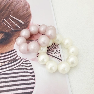 Set of two large pearlescent elastic hair ties in soft pink and cream white colors