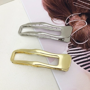 Minimalist wavy metal hair clips set in gold and silver finish for thick hair styling