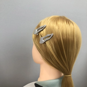 Set of two silver metallic hair clips with minimalist irregular fluid droplet design