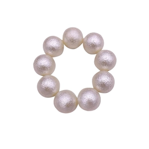 Elastic cream pearl hair tie with textured beads for elegant ponytail styling