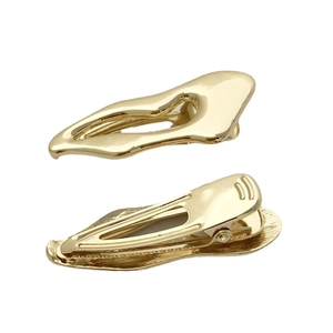 Minimalist golden irregular wave hair clips in polished metal with hollow streamline design