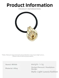 Detail of high-elastic black hair tie with twisted golden alloy buckle and luxury design