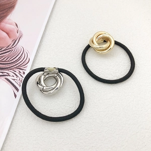 Set of minimalist gold and silver intertwined hair rings with durable black elastic ties