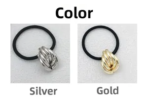 Detail of twisted metal knots in gold and silver finishes on elastic hair ties