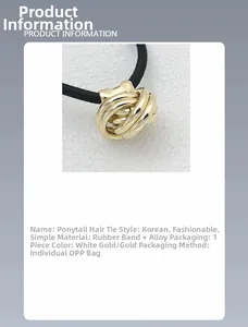Macro detail of the elegant golden alloy ring and durable black elastic ponytail holder