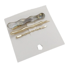 Three-piece hair clip set with marble wave pin and gold twist hairpins on display card