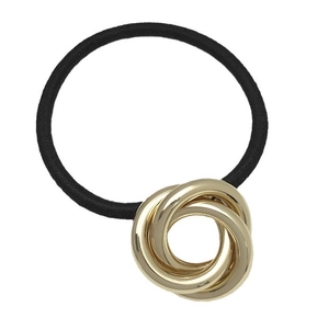 Minimalist elastic hair tie with three interlocking gold metal rings on a white background