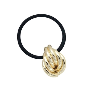 Minimalist black elastic hair tie featuring a polished gold twist alloy decorative accent