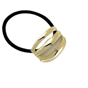 Minimalist ponytail hair tie with golden triple-layered hollow metallic decoration