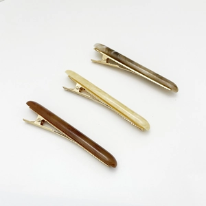 Three-piece minimalist resin duckbill hair clips in brown, white, and marble textures