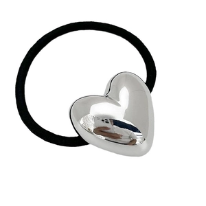 Minimalist elastic hair tie with a 3D silver heart charm for high ponytail hairstyles