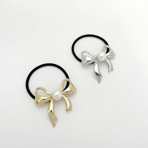 Elegant gold and silver bow hair ties set with pearls for high ponytail hairstyles
