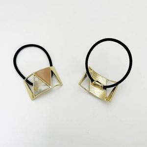 Set of two U-shaped alloy hair ties with geometric resin inserts in marble brown