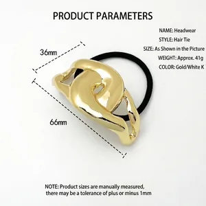 Polished gold alloy ponytail holder with modern knotted design on white background