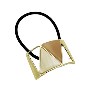 Minimalist U-shaped alloy hair tie with geometric resin color-block design on white background