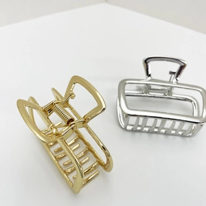 Minimalist square metal hair claw clips in polished gold and silver finishes