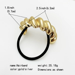 Elastic hair tie with textured gold twist metal charm for elegant ponytail styling