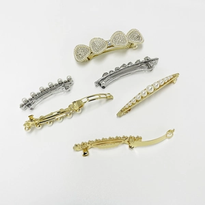 Elegant pearl hair clip set with sparkling rhinestones and golden metal bow spring barrette