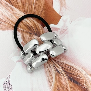 Close-up of high-elastic black hair tie with polished silver alloy chain decoration