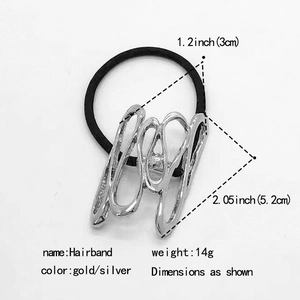 Close-up of a silver wavy geometric hair tie showing 5.2cm length and 14g weight details