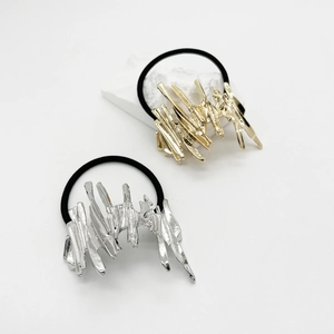 Lava style alloy ponytail holders in gold and silver finish on white background