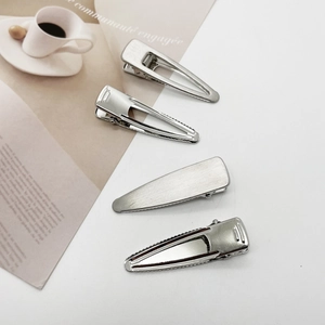 4-piece set of silver metal hair clips with brushed and polished finishes for women