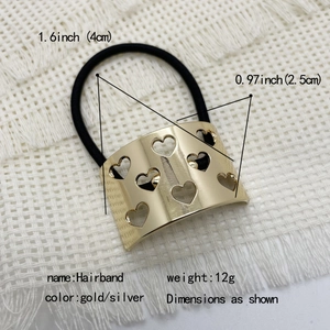 Macro view of gold heart cutout alloy hairband showing dimensions and weight details