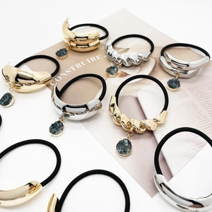 U-shaped alloy hair ties with green stone pendant in gold and silver finish