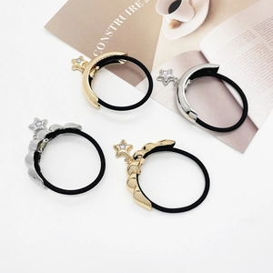Elegant 4-piece set of gold and silver metallic elastic hair ties with star charms