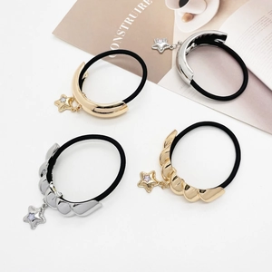 Set of minimalist hair ties with gold and silver metal accents and star pendants