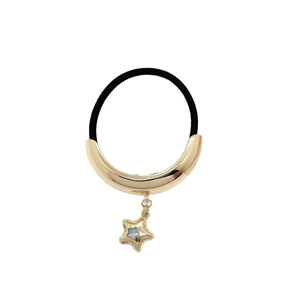 Minimalist black elastic hair tie with golden crescent metal and iridescent star charm