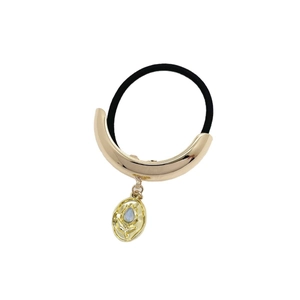 Minimalist U-shaped metal ponytail holder with blue gemstone pendant and floral relief
