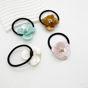 Floral acetate hair scrunchie set with resin petals and pearls for stylish women