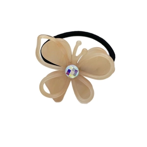 Sweet butterfly hair tie in milk coffee acetate with a sparkling rhinestone center