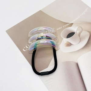 Detail view of U-shaped hair tie with iridescent acrylic accent and high-elastic band