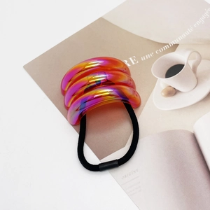 Close-up of vibrant iridescent U-shape hair tie with high-elastic black rubber band