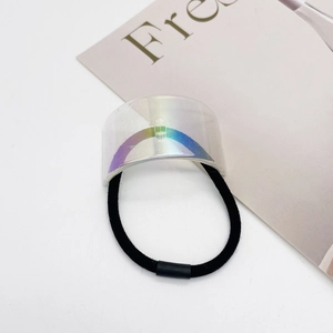 Macro shot of U-shaped hair tie with colorful laser holographic finish decorative plate