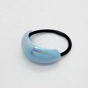 Close-up of a light blue iridescent crescent moon hair tie with high-elastic black cord
