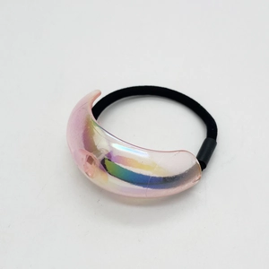 Macro shot of U-shaped rainbow acrylic hair tie with iridescent finish and black elastic