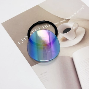 Minimalist high-elasticity black hair tie with a large iridescent holographic round charm