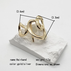 Minimalist golden alloy hair clip with hollow double heart design for low ponytail styling